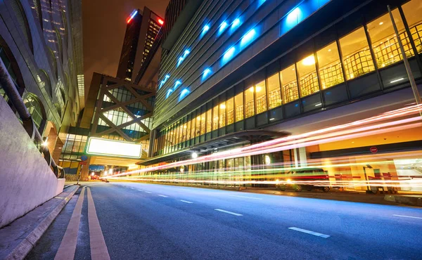 Modern buildings with light trails on night scene  background