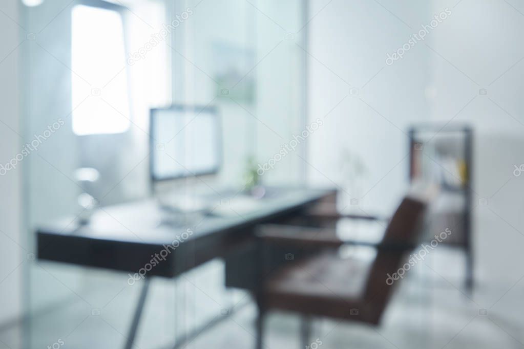 Blurred and defocused office workplace background , for commercial business ads using background .