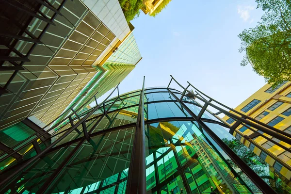 Low Angle Shot Modern Glass Buildings Green Clear Sky Background — Stock Photo, Image