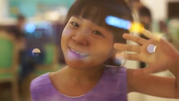 Footage Little Smiling Asian Girl Waving Hand — Stock Video