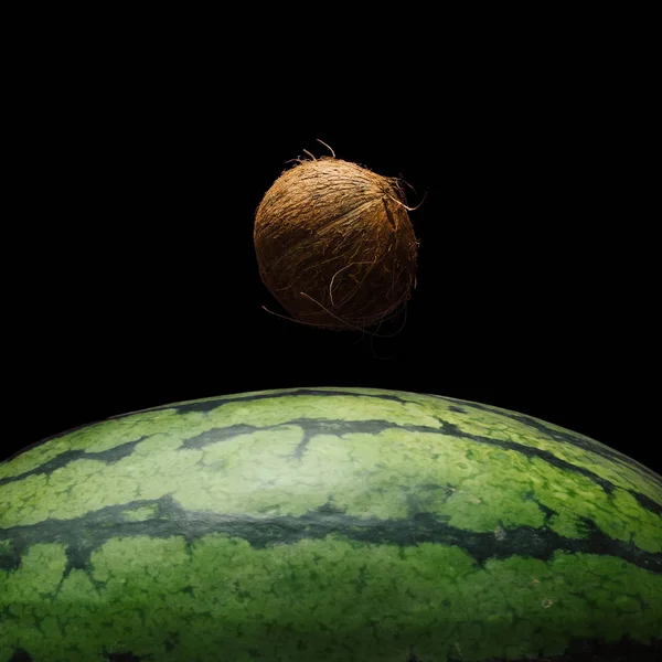 view of Earth from moon surface made of watermelon and coconut background on dark background,  Abstract space fruit concept