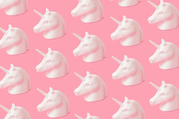 Creative unicorn pattern on pink background. Abstract art background. Minimal fantasy concept.