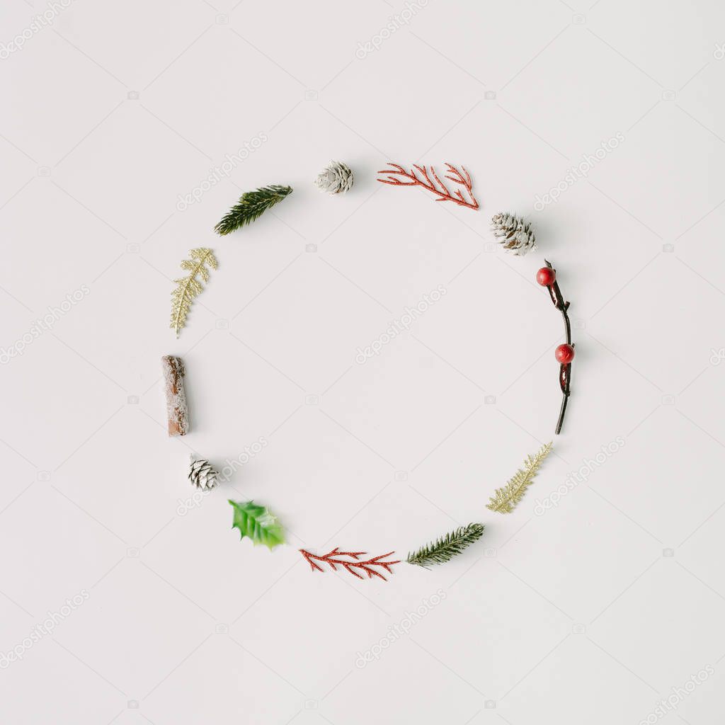 Christmas wreath made of branches with pine cones and leaves. Minimal holiday concept 