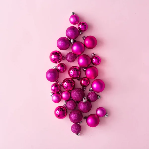 Pile Plastic Shiny Decorative Christmas Balls Pale Pink Background New — Stock Photo, Image
