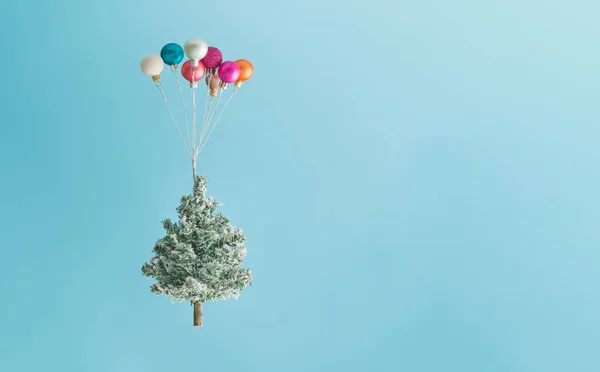 Christmas Tree Lifted Colorful Balloon Ornaments Sky Blue Background New — Stock Photo, Image