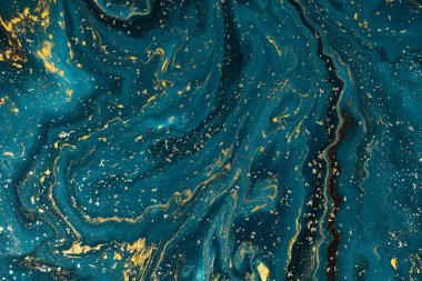 Abstract blue paint background with golden glitter powder  clipart
