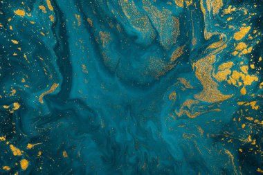 Abstract blue paint background with golden glitter powder  clipart