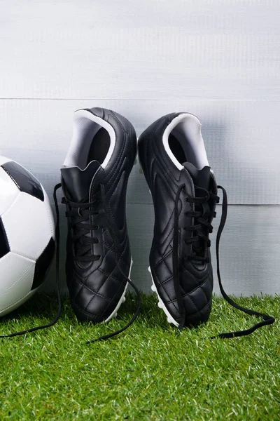 Soccer Ball Boots Lying Grass Gray Background — Stock Photo, Image