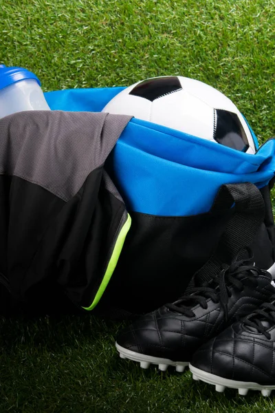 Soccer Ball Sports Bag Shirt Black Boots Grass Background — Stock Photo, Image