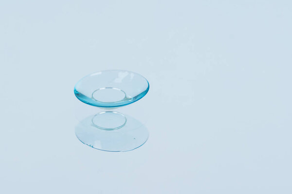 lens to correct vision lies on the glass, close-up