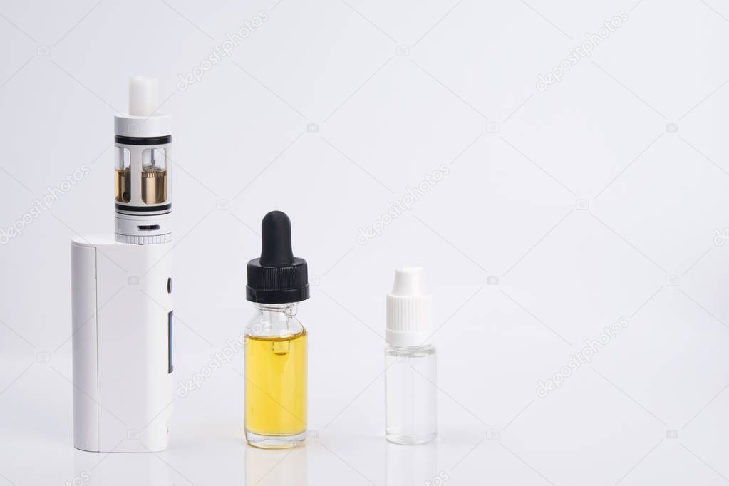 on a light background, a white electronic cigarette, with a choice of 2 aromas of liquids.