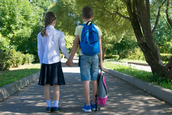 Boy Carries Girl Backpack Way House — стоковое фото