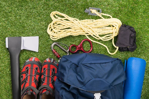 things for a long hike in the forest and survival in it, set on a green lawn