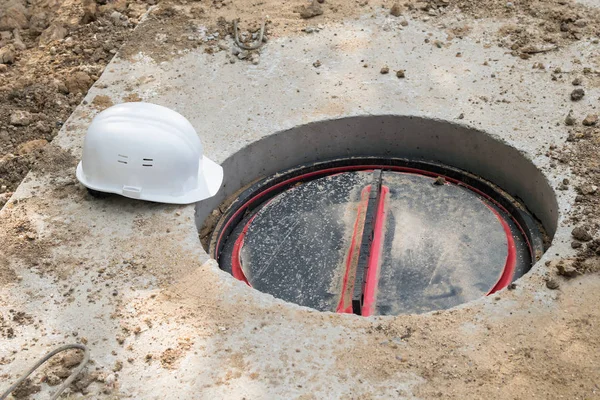 builder hatch and work helmet on the ground, top view
