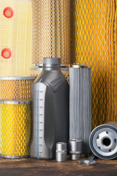 background, from a set of items, air filters, engine oil in a bottle, car repair keys