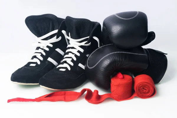 boxing concept: shoes and training equipment, isolated on white