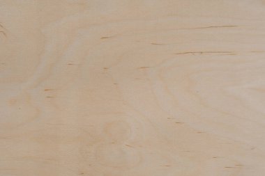 Açık ahşap bir yüzeye yakın çekim. Dokuda doğal tahıl, düğüm ve çatlaklar var. Arkaplan, tasarım veya materyal referansı için ideal.