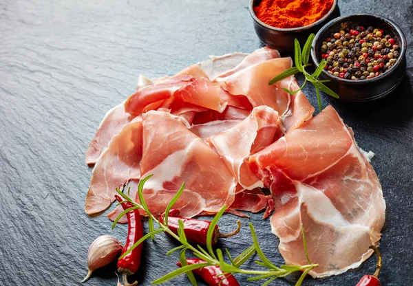 Spanish Dry Cured Ham Jamon Curado Thinly Sliced Served Black — Stock Photo, Image