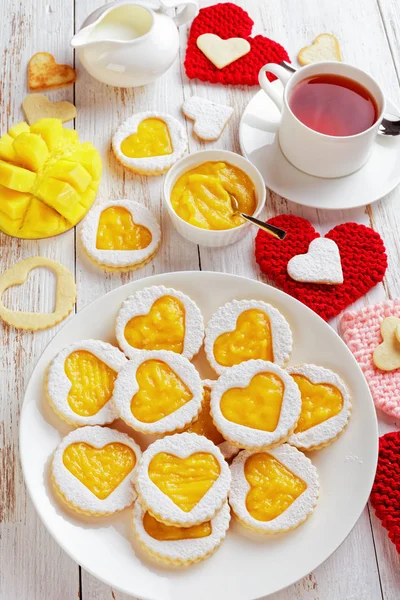 Close Heart Shaped Linzer Cookies Mango Jam White Plate Table — Stock Photo, Image