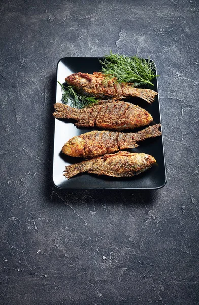 Crispy fried crispy crucian carps, vertical view — Stock Image Crispy fried crispy crucian carps, vertical view Stock Image