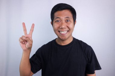 Smiling face expression asian man giving five finger signs isolated on white background.