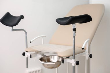 Gynecological chair. Gynecological cabinet.  Woman health, newborn and pregnancy concept clipart