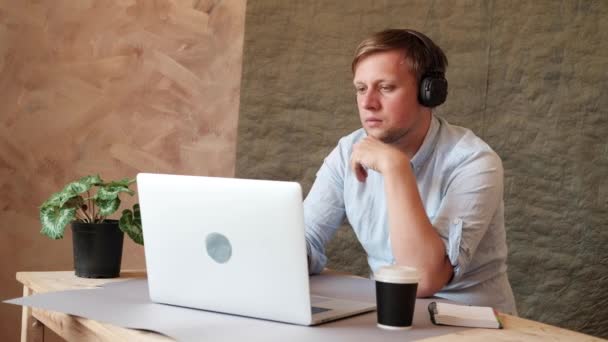 Man Typing Laptop Keyboard Listening Music Headphones Drinking Coffee Reelance — Stock Video