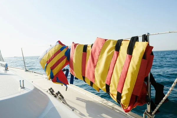 Life jackets sailing on boat of yacht. safety equipment on ocean ship. travel, yachting cruise. Security on regatta
