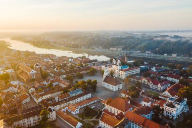 Autumm fog over Kaunas old town, Lithuania. Sunrise moment. Drone aerial view clipart