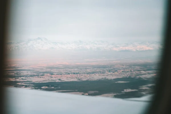 Italian Alps view through airplane window — Stock Photo, Image