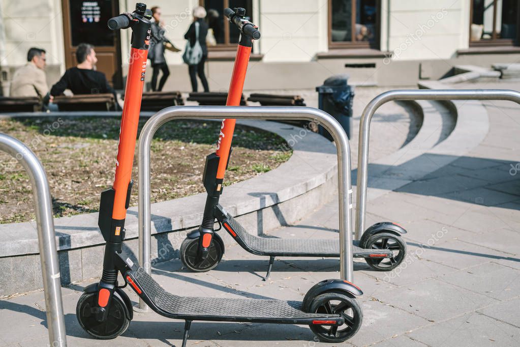 VILNIUS, LITHUANIA - APRIL 06, 2019: Electric scooters CityBee, launched in 2019, people can rent and unlock directly from their phone