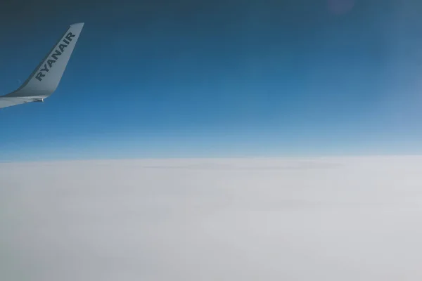 View of Ryanair logo through the airplane window — Stock Photo, Image