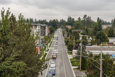 ABBOTSFORD, CANADA - MAY 29, 2019: street view of small town residential housing in spring time. clipart