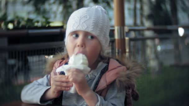 Cute Toddler Girl White Knitted Hat Eating Ice Cream — Stock Video