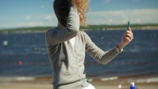 Woman Uses Smartphone Beach — Stock Video