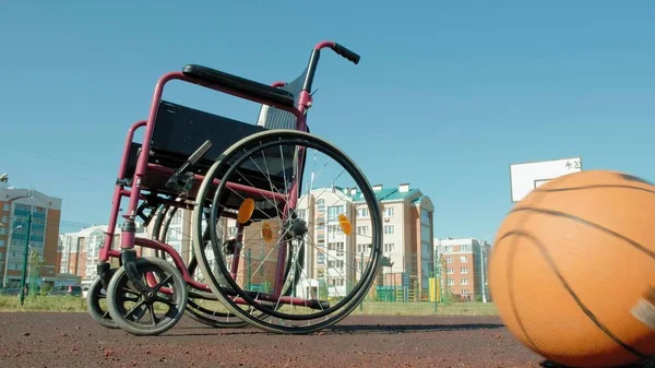 Type of wheelchair with a basket ball on a sports volleyball court4k