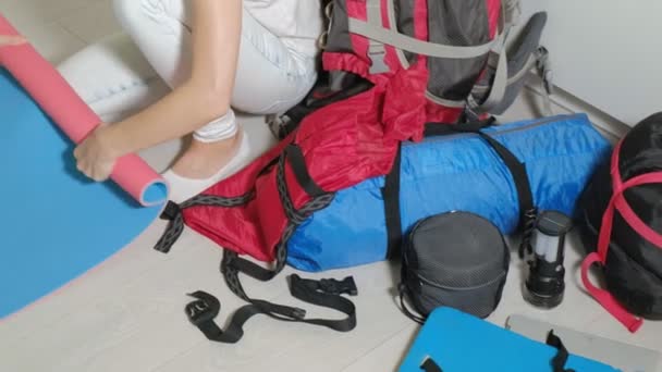 Woman Tourist Collects Things Backpack Kitchen House Prepares Trip — Stock Video