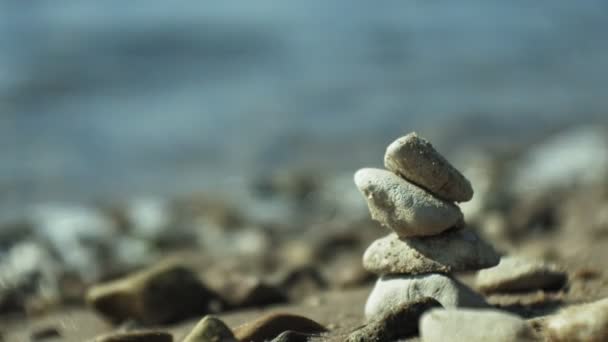 Stack of stones and Sea Splash — Stock Video