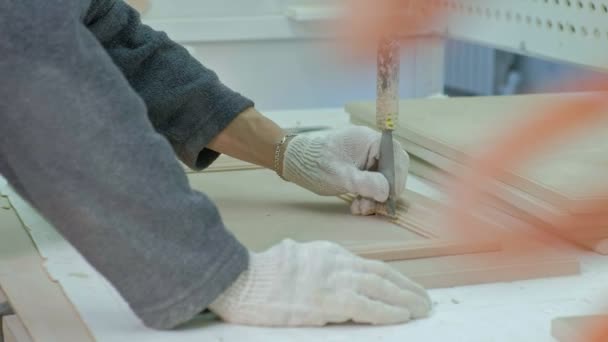 Male Worker Gluing Wooden Blanks For A Door Production Of Interior Doors Of Wood