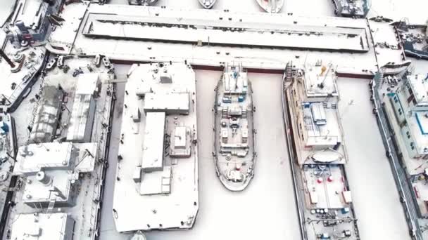 River port, standing of cargo ships, vessel with a crane, winter, aerial survey, top view — Stock Video