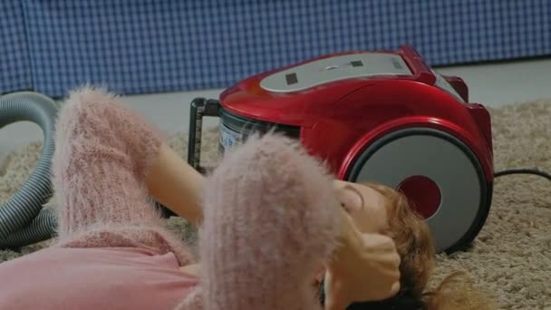 Happy Young Woman Housewife Vacuum Cleaner Lying Half Headphones Uses — Stock Video