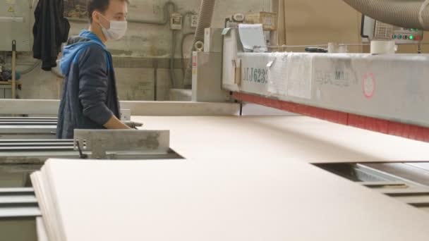 A Man Saws Wooden Door Blanks On The Machine The Production Of Village Interior Doors