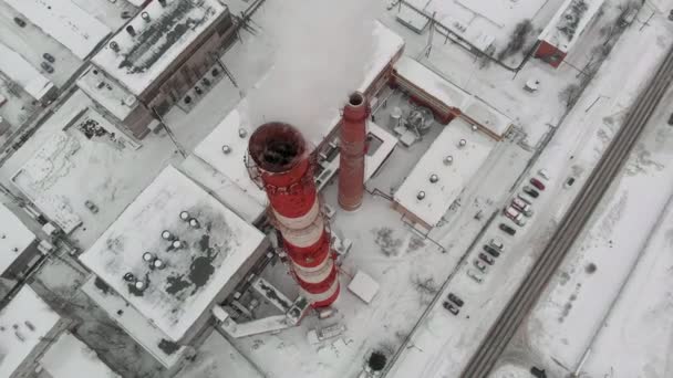 Clouds of smoke rise into the sky from pipe in the industrial sector of the city, a city boiler room. aerial filming — Stock Footage Clouds of smoke rise into the sky from pipe in the industrial sector of the city, a city boiler room. aerial filming Royalty Free Stock Footage