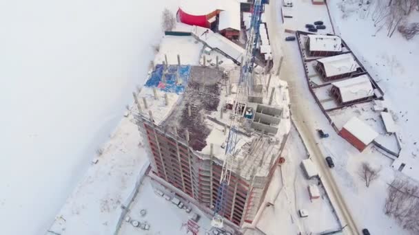 Sitio de construcción residencial, invierno, vista aérea, disparo de helicóptero — Vídeos de Stock