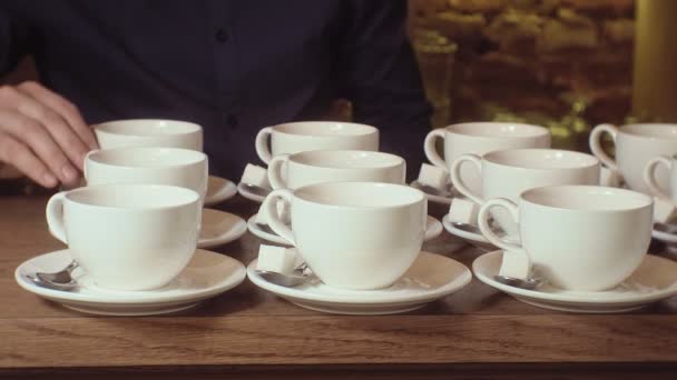 Many empty white clean tea cups — Stock Video