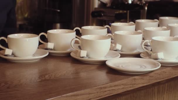 Many empty white clean tea cups — Stock Video