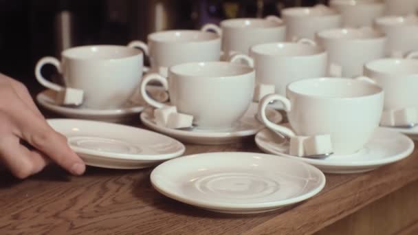 Many empty white clean tea cups — Stock Video