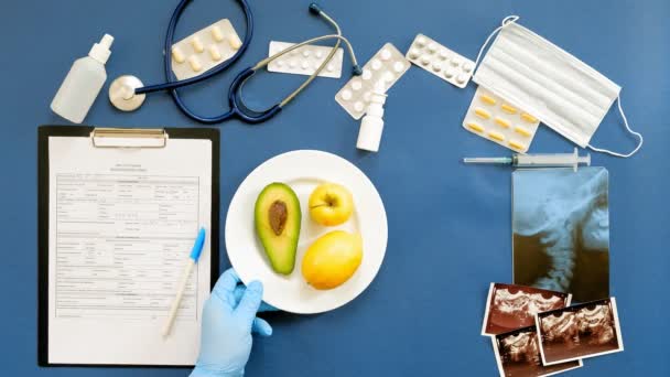 Doctors desk, top view on blue background, medicine concept — Stock Video