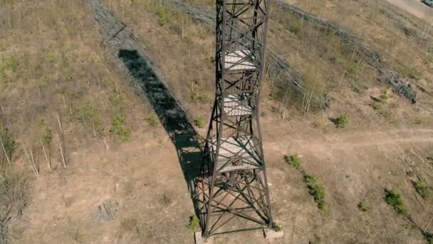 Metal tower in the field, aerial shooting — Stock Video