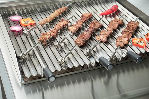 Kitchen electric grill with stones for the network catering. Professional kitchen equipment